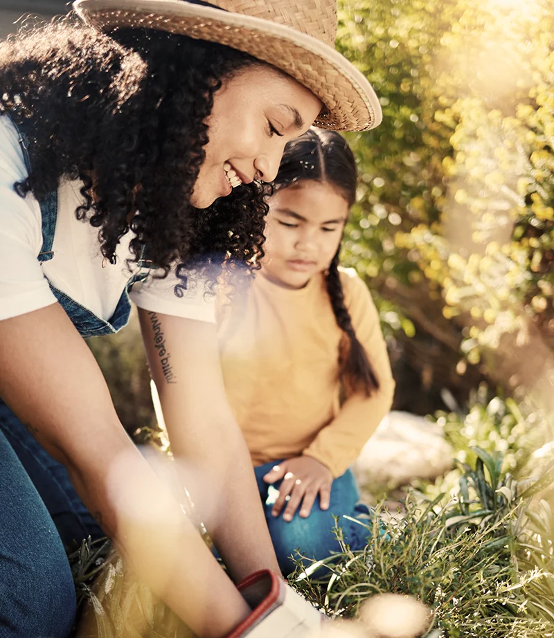 Adult and child connecting with nature, representing continued support, self-empowerment, and integration between sessions.