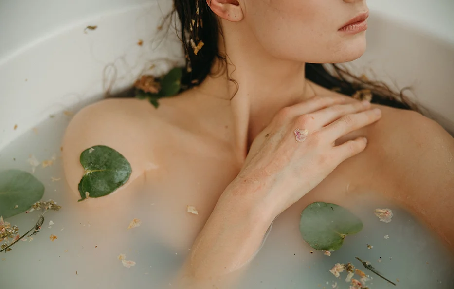 Woman resting in water, representing nervous system safety and repetitive behaviours as attempts to self-regulate.