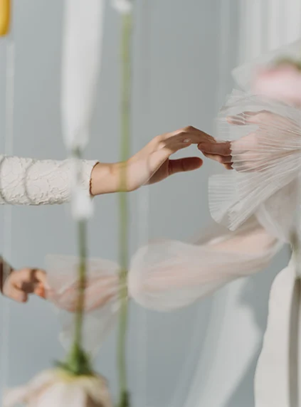 Hands reaching toward each other during somatic healing and body awareness